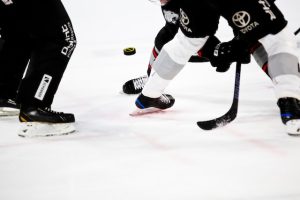 hockey players skating on ice